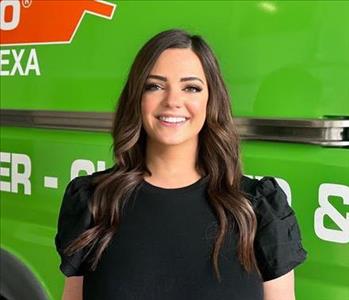 Woman standing in front of SERVPRO Fleet 